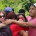 Venezuelan migrants console each other after seeing off a group of 97 Venezuelans including their family members and friends who were being deported in August 2023. FILE PHOTO/GREVIC ALVARADO Relatives console each other after 97 Venezuelans were deported on Saturday. -
