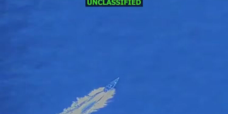 In this screengrab taken from a video posted by Defense Secretary Pete Hegseth on Friday, a boat is visible just before it is hit by a military strike, off the coast of Venezuela. In his post, Hegseth said the boat was trafficking narcotics and that four men onboard were killed. Pete Hegseth/X