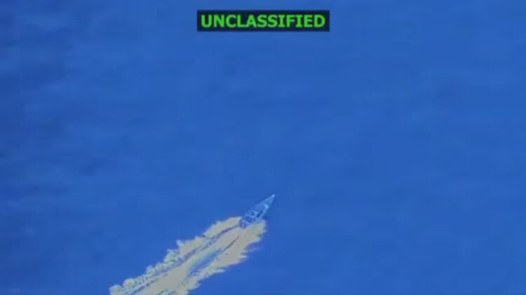 In this screengrab taken from a video posted by Defense Secretary Pete Hegseth on Friday, a boat is visible just before it is hit by a military strike, off the coast of Venezuela. In his post, Hegseth said the boat was trafficking narcotics and that four men onboard were killed. Pete Hegseth/X