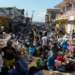 Community members sift through storm-tossed debris in Black River, Jamaica, days after Hurricane Melissa swept the coast. Photo Credit - Matias Delacroix