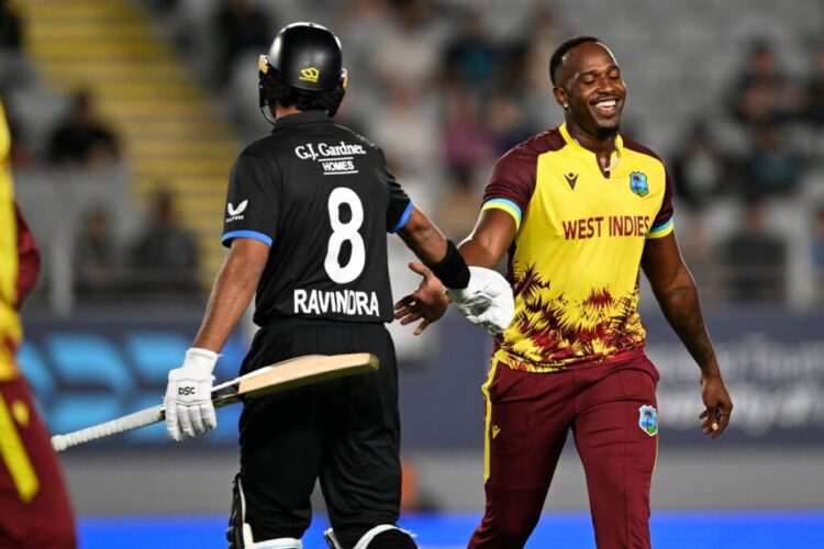 New Zealand’s Rachin Ravindra (L) gestures to West Indies bowler Matthew Forde during the T20 match in Auckland, New Zealand, on November 5. - AP Photo