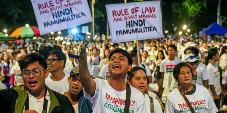 People taking part in a mass demonstration against government corruption at Rizal Park in Metro Manila, Philippines, on Sunday.Daniel Ceng / Anadolu via Getty Images