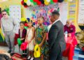 ERC Chairman Shaikh Moeenul Hack (L) with pupils of Comenius Primary in cultural wear -Nov.19,2025