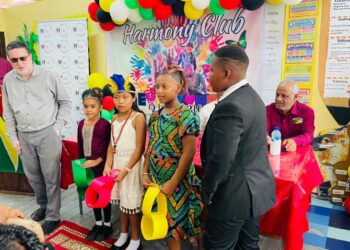 ERC Chairman Shaikh Moeenul Hack (L) with pupils of Comenius Primary in cultural wear -Nov.19,2025