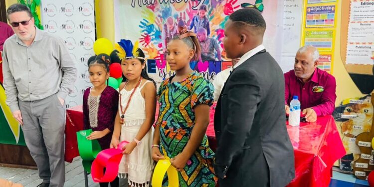 ERC Chairman Shaikh Moeenul Hack (L) with pupils of Comenius Primary in cultural wear -Nov.19,2025