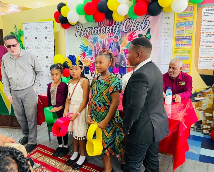 ERC Chairman Shaikh Moeenul Hack (L) with pupils of Comenius Primary in cultural wear -Nov.19,2025
