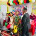 ERC Chairman Shaikh Moeenul Hack (L) with pupils of Comenius Primary in cultural wear -Nov.19,2025