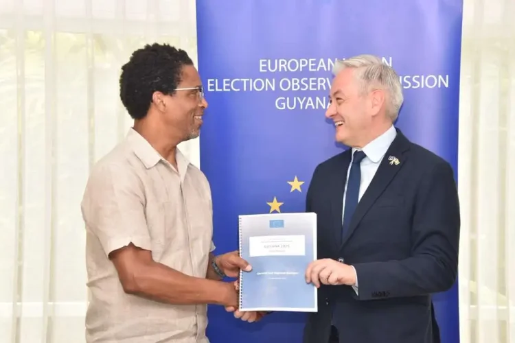 EU Rep handing over Mission's Report on the 2025 General and Regional Elections to APNU Lead Parliamentarian Dr. Terrence Campbell