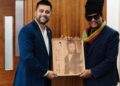 Maxi Priest and Faizal Khan with Signed Maxi Priest Greenheart Wooden Engraved Plaque created by Branderz Guyana