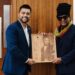 Maxi Priest and Faizal Khan with Signed Maxi Priest Greenheart Wooden Engraved Plaque created by Branderz Guyana