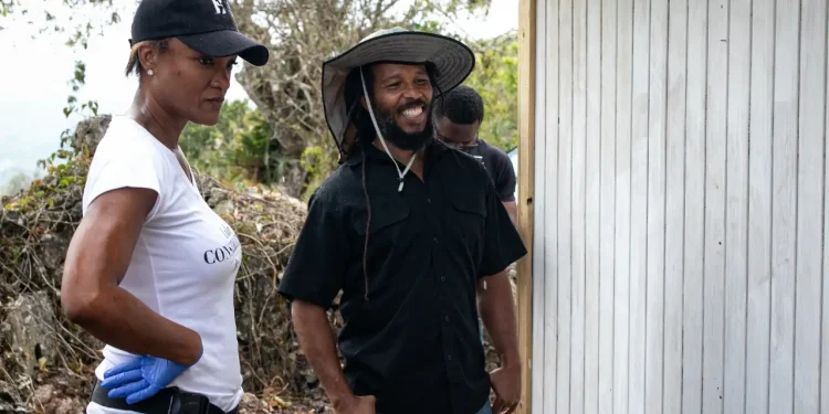 BossMom's Michelle Gordon and Ziggy Marley on site at a house build recently in association with Food for the Poor.