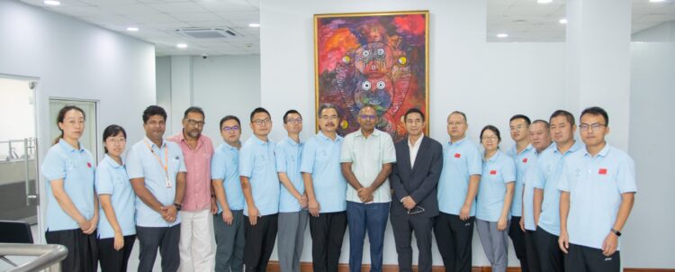 Minister of Health Dr. Frank Anthony (centre) with the Chinese doctors (in blue) and other members of Guyana's health team