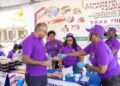 Minister of Health Dr Frank Anthony receiving his filaria pills