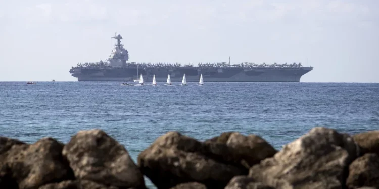 The USS Gerald R. Ford is anchored in the Bay of Palma after arriving to Spain's Palma de Mallorca on Oct. 3, 2025. The world's largest aircraft carrier is due to arrive in the northern Caribbean on Sunday as tensions with Venezuela grow.
Jaime Reina/AFP via Getty Images
