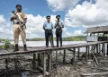 Inspector Marcel Sandy, Sgt Charles Walker, left, and Constable Alester Prestano on the Guyanese border at Imbotero Credit: Simon Townsley
