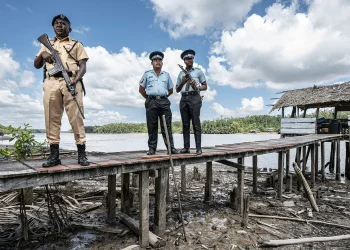 Inspector Marcel Sandy, Sgt Charles Walker, left, and Constable Alester Prestano on the Guyanese border at Imbotero Credit: Simon Townsley