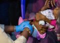 © UNICEF/Ahmed Mohamdeen Elfatih A baby receives a malaria vaccine in Sudan.