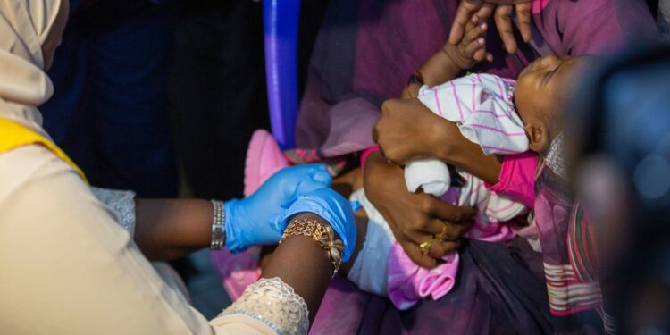 © UNICEF/Ahmed Mohamdeen Elfatih A baby receives a malaria vaccine in Sudan.