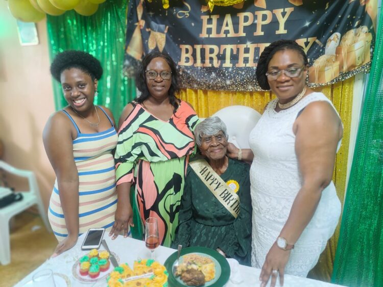 L-R Jasmine Hackett (PNCR Councillor, Reg 4, fmr Minister of Foreign Affairs Dr. Karen Cummings, 106-year-old Ruby Mingo and and Member of Parliament and GTU President Coretta McDonald
