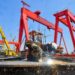 A worker prefabricates steel for Bohai Oilfield platform at an intelligent manufacturing base in Tianjin, north China, March 30, 2025. (Photo by Du Penghui/Xinhua)