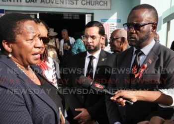 Opposition Leader Pennelope Beckles speaks to the media, after the funeral of PNM stalwart Ferdinand 'Ferdie' Ferreira, at Seventh-Day Adventist Church, Stanmore Avenue, Port of Spain, on December 16. - Photo by Angelo Marcelle