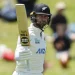 Devon Conway raises his bat after getting to his first half-century against West Indies  •  Getty Images