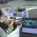 A visitor gets to grips with a Nio cabin at the World Artificial Intelligence Conference in Shanghai in July 2024. CHINA DAILY