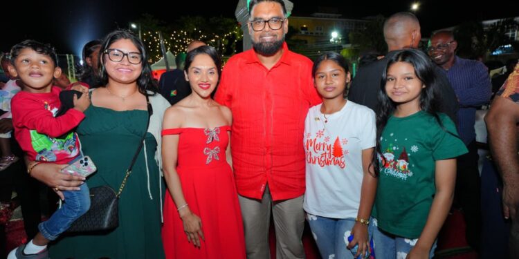 President Irfaan Ali and First Lady Arya Ali ( in red) at the Friday night's event (President Ali face book photo)