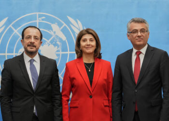 Republic of Cyprus President Nikos Christodoulides, United Nations Secretary-General's Personal Envoy on Cyprus, Maria Angela Holguin Cuellar, and Turkish Cypriot leader Tufan Erhurman pose for a photograph at the U.N. compound inside the UN buffer zone, in Nicosia, Cyprus, December 11, 2025. Petros Karadjias/Pool via REUTERS Purchase Licensing Rights