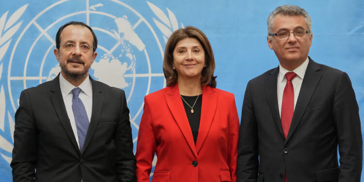 Republic of Cyprus President Nikos Christodoulides, United Nations Secretary-General's Personal Envoy on Cyprus, Maria Angela Holguin Cuellar, and Turkish Cypriot leader Tufan Erhurman pose for a photograph at the U.N. compound inside the UN buffer zone, in Nicosia, Cyprus, December 11, 2025. Petros Karadjias/Pool via REUTERS Purchase Licensing Rights