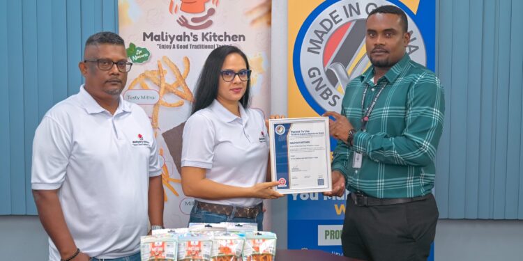 Founders, Mark Singh and Alyssa Singh, receive the GNBS Made in Guyana Certificate from Head of Certification Services Dept. (ag), Keon Rankin