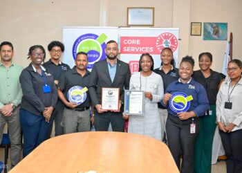 (L-R) GFSL Quality Officer, Abidin Mohamed, PS-Ministry of Home Affairs Andre Ally and Director(ag) of GFSL Ms. Charis Griffith along with staff of GFSL