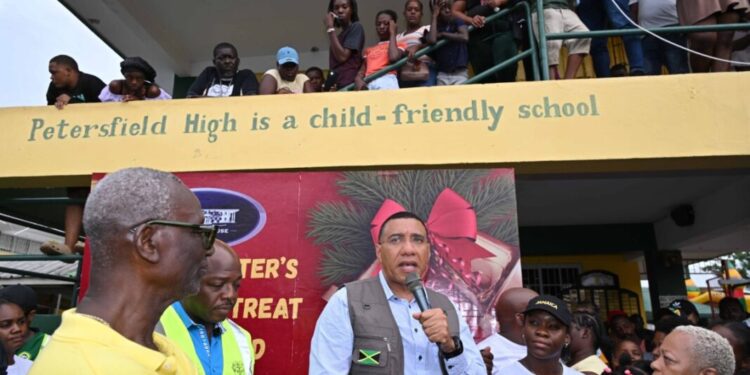 Prime Minister, Dr. the Most Hon. Andrew Holness (centre) addresses residents at the Petersfield High School in Westmoreland on Saturday (December 13) during the Prime Minister's Christmas Treat. Photo: RUDRANATH FRASER
