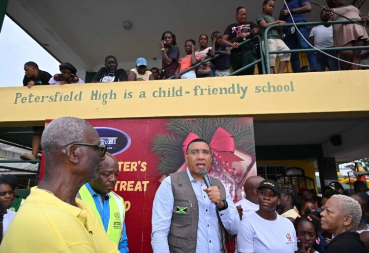 Prime Minister, Dr. the Most Hon. Andrew Holness (centre) addresses residents at the Petersfield High School in Westmoreland on Saturday (December 13) during the Prime Minister's Christmas Treat. Photo: RUDRANATH FRASER