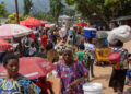 Congolese civilians walk at Maendeleo market as calm returns after clashes between members of the Alliance Fleuve Congo (AFC) and the M23 Movement, who took control of Uvira from the Armed Forces of the Democratic Republic of the Congo (FARDC), in Uvira on the shores of Lake Tanganyika, South Kivu province, Democratic Republic of the Congo, December 15, 2025. REUTERS/Stringer/File Photo Purchase Licensing Rights