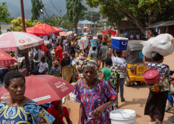 Congolese civilians walk at Maendeleo market as calm returns after clashes between members of the Alliance Fleuve Congo (AFC) and the M23 Movement, who took control of Uvira from the Armed Forces of the Democratic Republic of the Congo (FARDC), in Uvira on the shores of Lake Tanganyika, South Kivu province, Democratic Republic of the Congo, December 15, 2025. REUTERS/Stringer/File Photo Purchase Licensing Rights