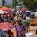 Congolese civilians walk at Maendeleo market as calm returns after clashes between members of the Alliance Fleuve Congo (AFC) and the M23 Movement, who took control of Uvira from the Armed Forces of the Democratic Republic of the Congo (FARDC), in Uvira on the shores of Lake Tanganyika, South Kivu province, Democratic Republic of the Congo, December 15, 2025. REUTERS/Stringer/File Photo Purchase Licensing Rights