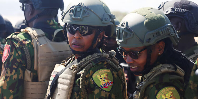 Kenyan police officers share a moment after landing to reinforce a security mission to tackle violence in Haiti, in Port-au-Prince, Haiti February 6, 2025. REUTERS/Ralph Tedy Erol Purchase Licensing Rights