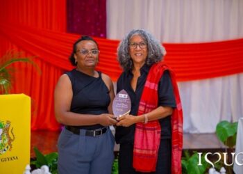 Director of the Institute for Gender Studies, Dr Lisa Edwards, presents a token of appreciation to Professor Emerita Kamala Kempadoo of York University during the IGS’ 10th anniversary celebration at the University of Guyana’s Education Lecture Theatre.