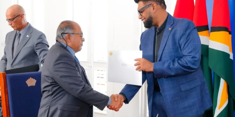 The head of state making the presentation to Justice Rafiq Khan