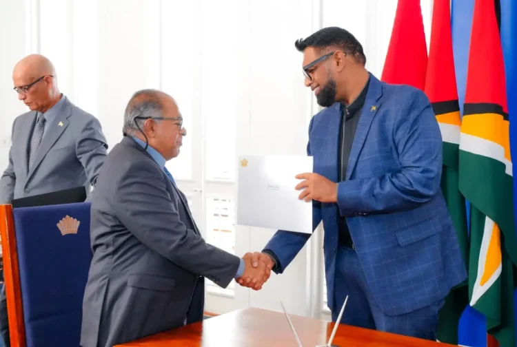 The head of state making the presentation to Justice Rafiq Khan