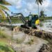 Excavator at work in the Black Bush Polder flooded area (Office of the President photo)