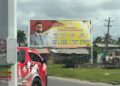 Billboard of President Ali's promised cash grant
