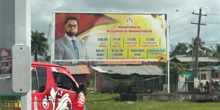 Billboard of President Ali's promised cash grant