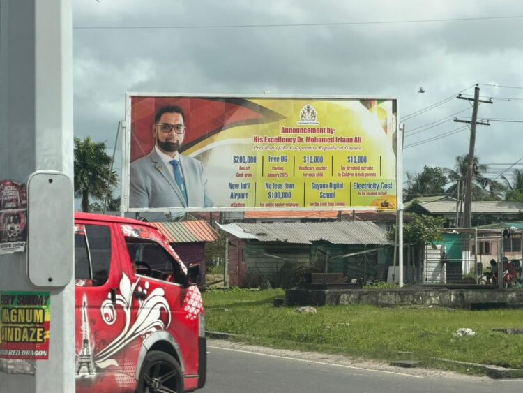 Billboard of President Ali's promised cash grant