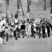 Young Muslims gather around the green and white FLN rebel flag in Diar el Mahcoul, a suburb of Algiers, ignoring French orders to stay at home, Oct. 31, 1969. (AP Photo/ H. Babout, file)