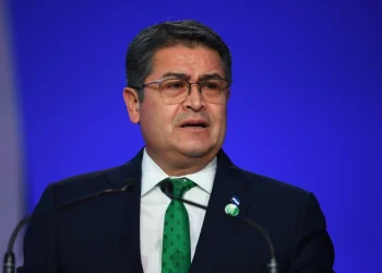 Honduras’ President Juan Orlando Hernandez speaks during the opening ceremony of the UN Climate Change Conference COP26 in Glasgow, Scotland, Monday Nov. 1, 2021. Andy Buchanan/Pool via AP, File)