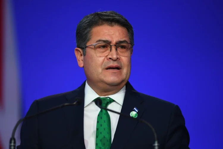 Honduras’ President Juan Orlando Hernandez speaks during the opening ceremony of the UN Climate Change Conference COP26 in Glasgow, Scotland, Monday Nov. 1, 2021. Andy Buchanan/Pool via AP, File)