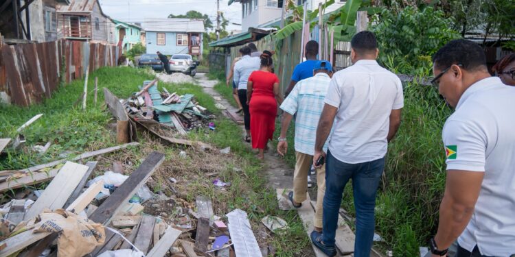 WIN leader, Azruddin Mohamed and team walking through the garbage-filled city