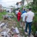WIN leader, Azruddin Mohamed and team walking through the garbage-filled city